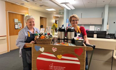 Two Ronald McDonald House Charities volunteers with the new hospitality cart at PeaceHealth Sacred Heart Medical Center at RiverBend
